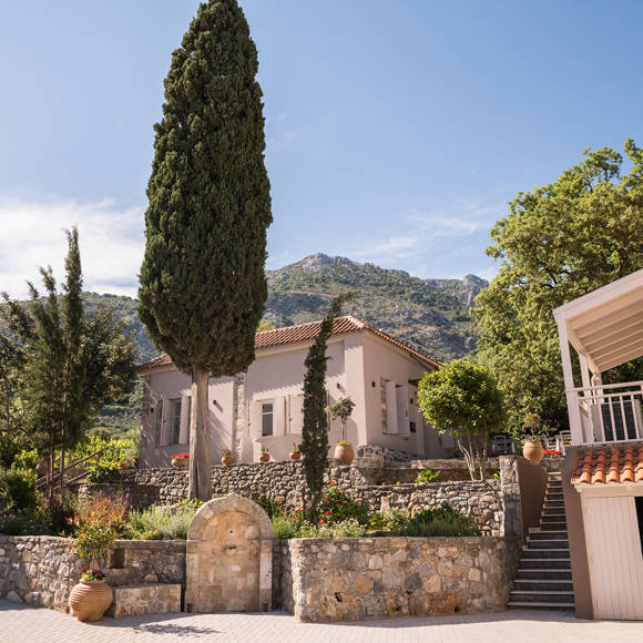 Stone-built villas and lush gardens at Avdou Collection by Trend Hotels surrounded by Cretan mountains