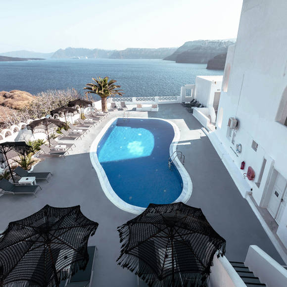 Aerial view of the pool and caldera at Santorini View Hotel by Trend Hotels in Akrotiri
