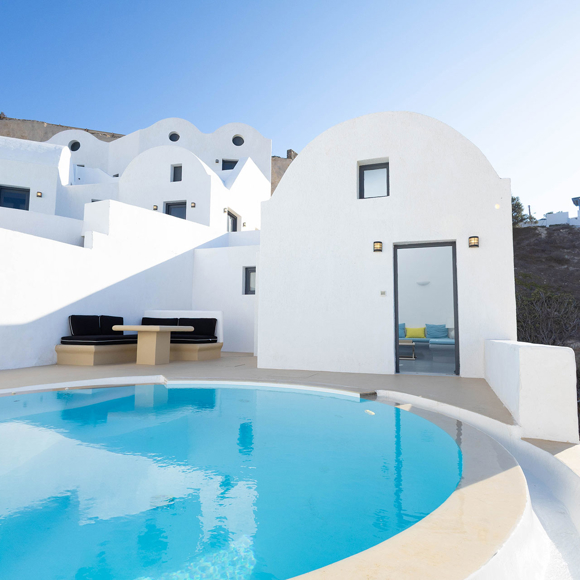 Private pool at Grand Ambassador by Trend Hotels featuring Cycladic architecture and outdoor seating